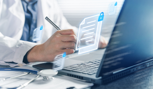 Doctor using a laptop for secure digital healthcare documentation