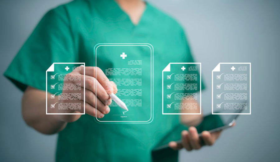Healthcare professional interacts with digital medical records on a virtual screen.