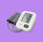 Digital blood pressure monitor with readings on a purple background